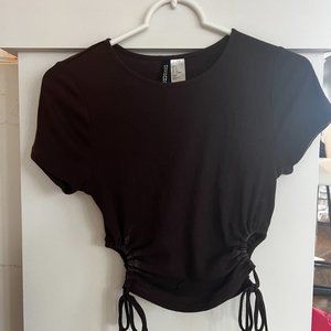 dark brown short sleeve top with cut out tie detail
